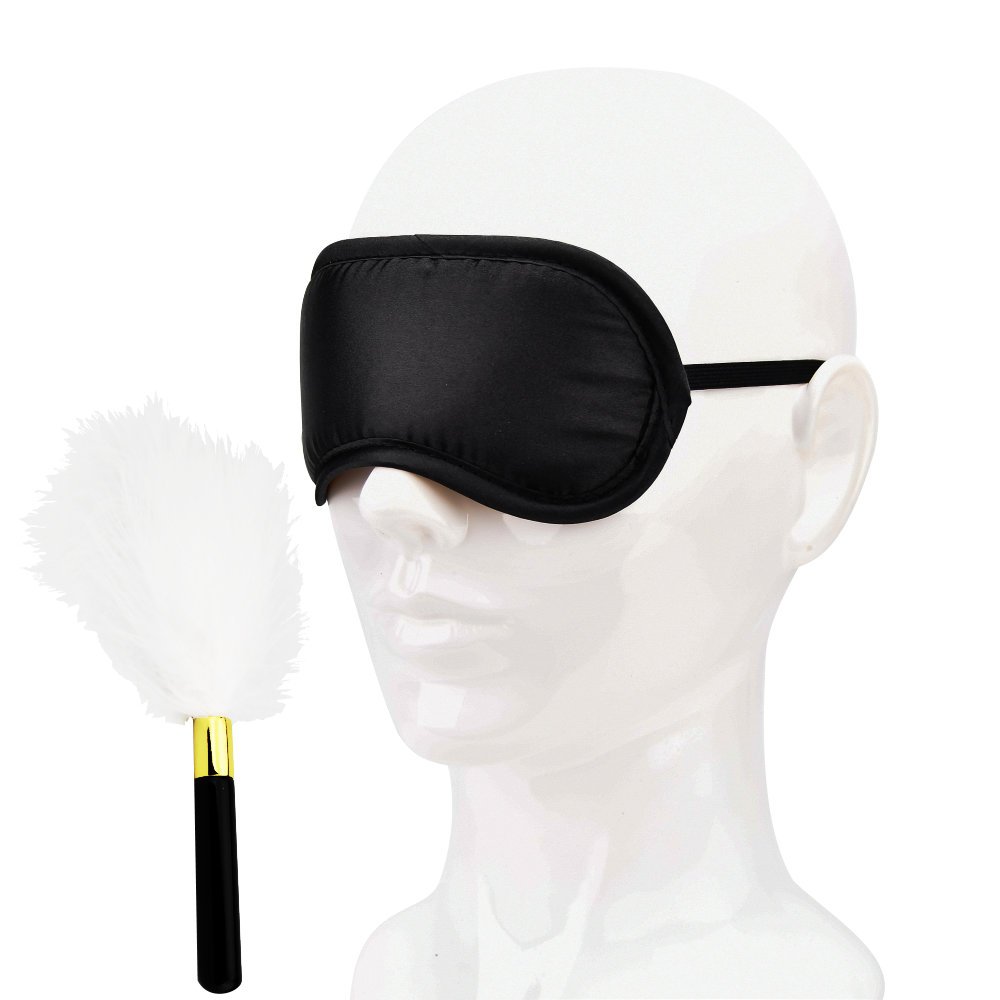 Bound to Play black eye mask on mannequin head with white feather tickler and black handle
